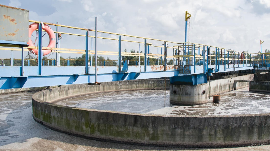 Clarification tank and access bridge at a water-treatment works.